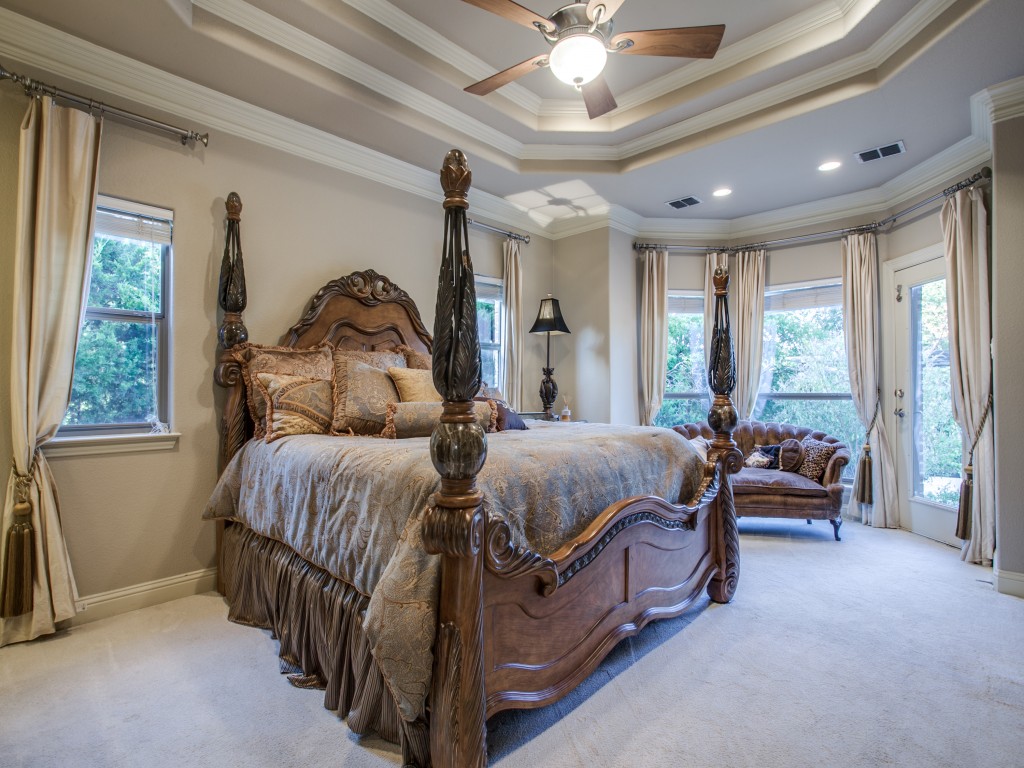 The finer details in the beautiful crown molding and double trays, TV niche, ceiling to floor silk curtains in the master suite lend to the feel of luxury. 