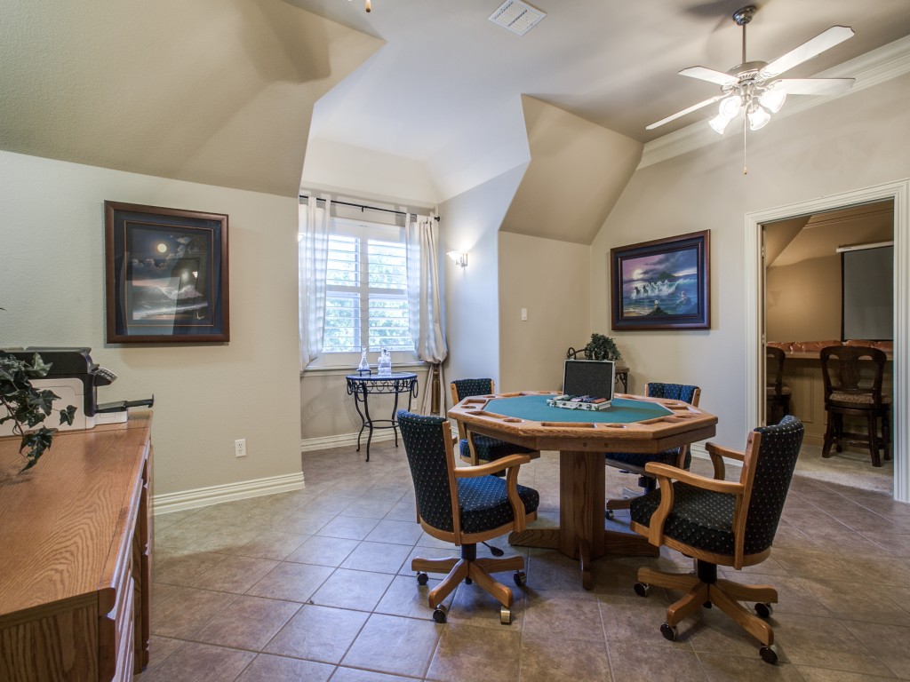 This game room is presently outfitted with a pool table and is large enough to play without feeling cramped. in addition, the kitchenette-sized wet bar area features extra storage.