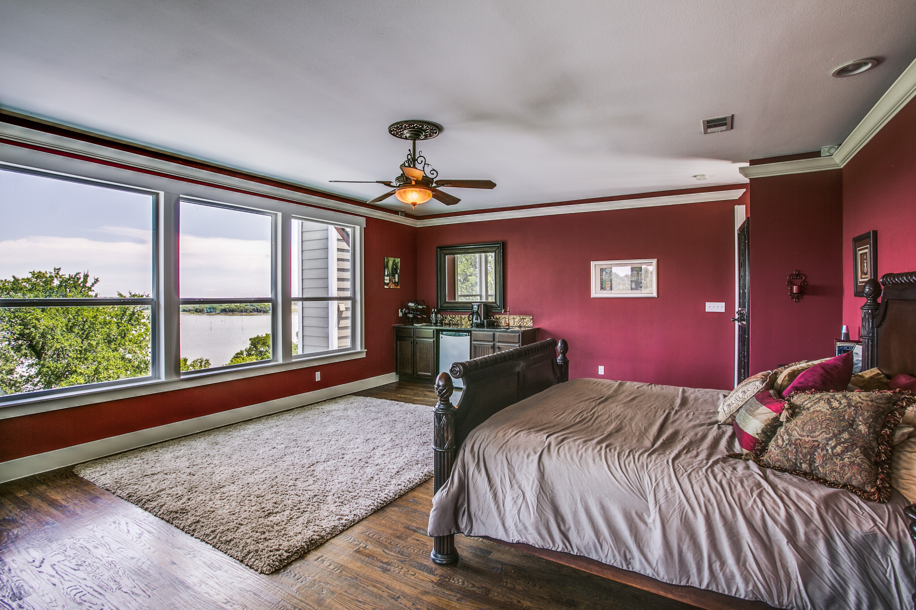 The entire 3rd floor houses the Master suite. You won't even have to leave your bedroom until you're ready to start your day. Grab coffee & breakfast from the custom coffee bar.  Wake up with the sunrise & what a view from this height!