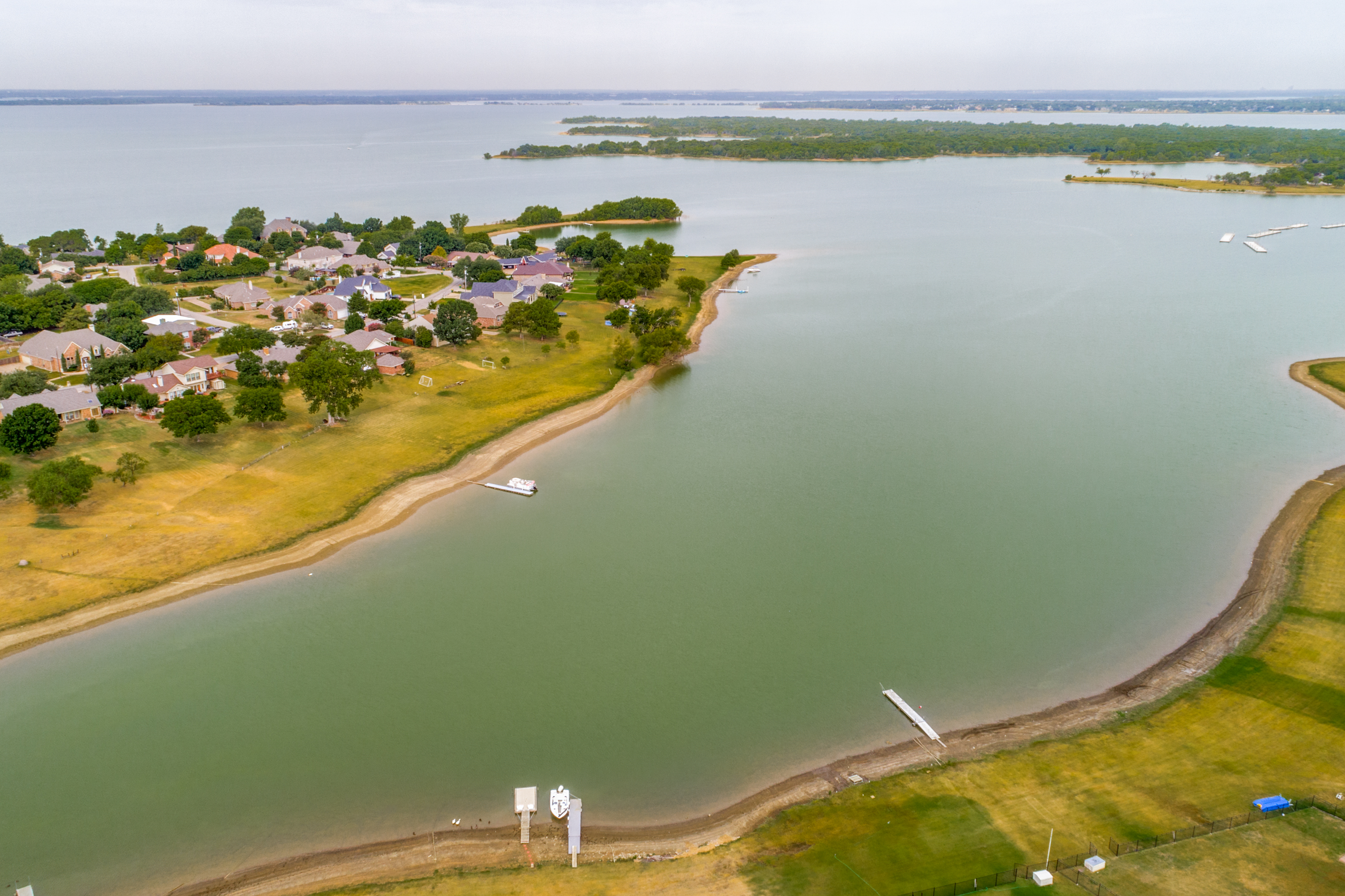 Sitting in a quiet cove provides easy lake access. Look at that gorgeous view!  Come see this lakefront home before it's gone!