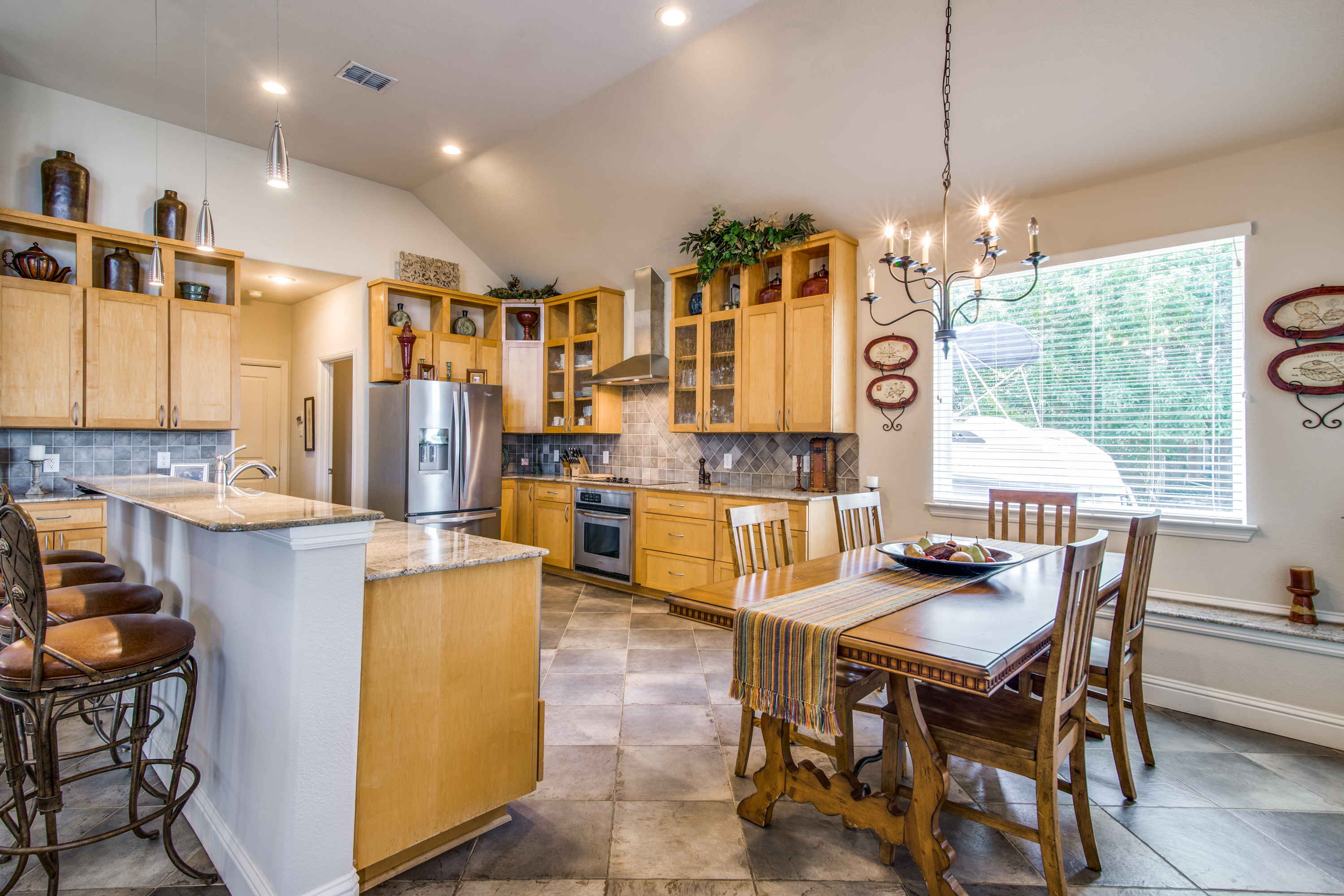 The kitchen is designed with a large breakfast bar & casual dining.